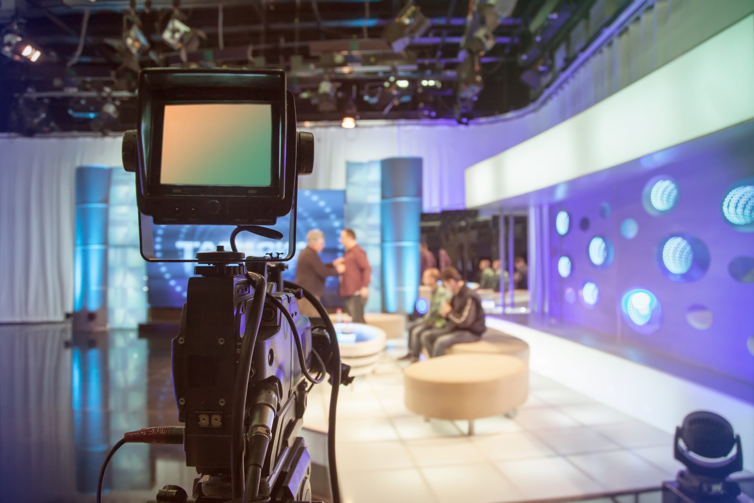 television studio with camera and lights recording tv show